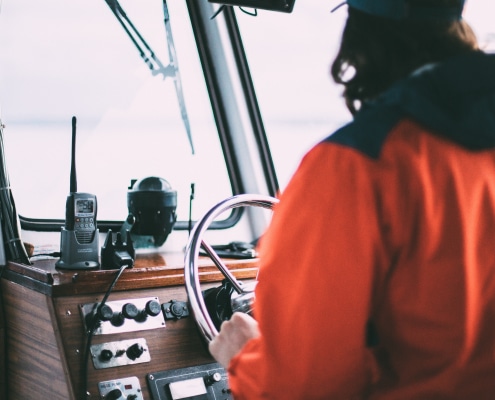 Person on boat with a VHF radio