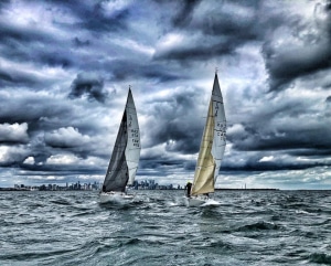 Story sky - rough seas - sailboats racing