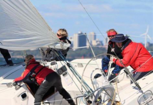 women's sailing programs - racing a sailboat
